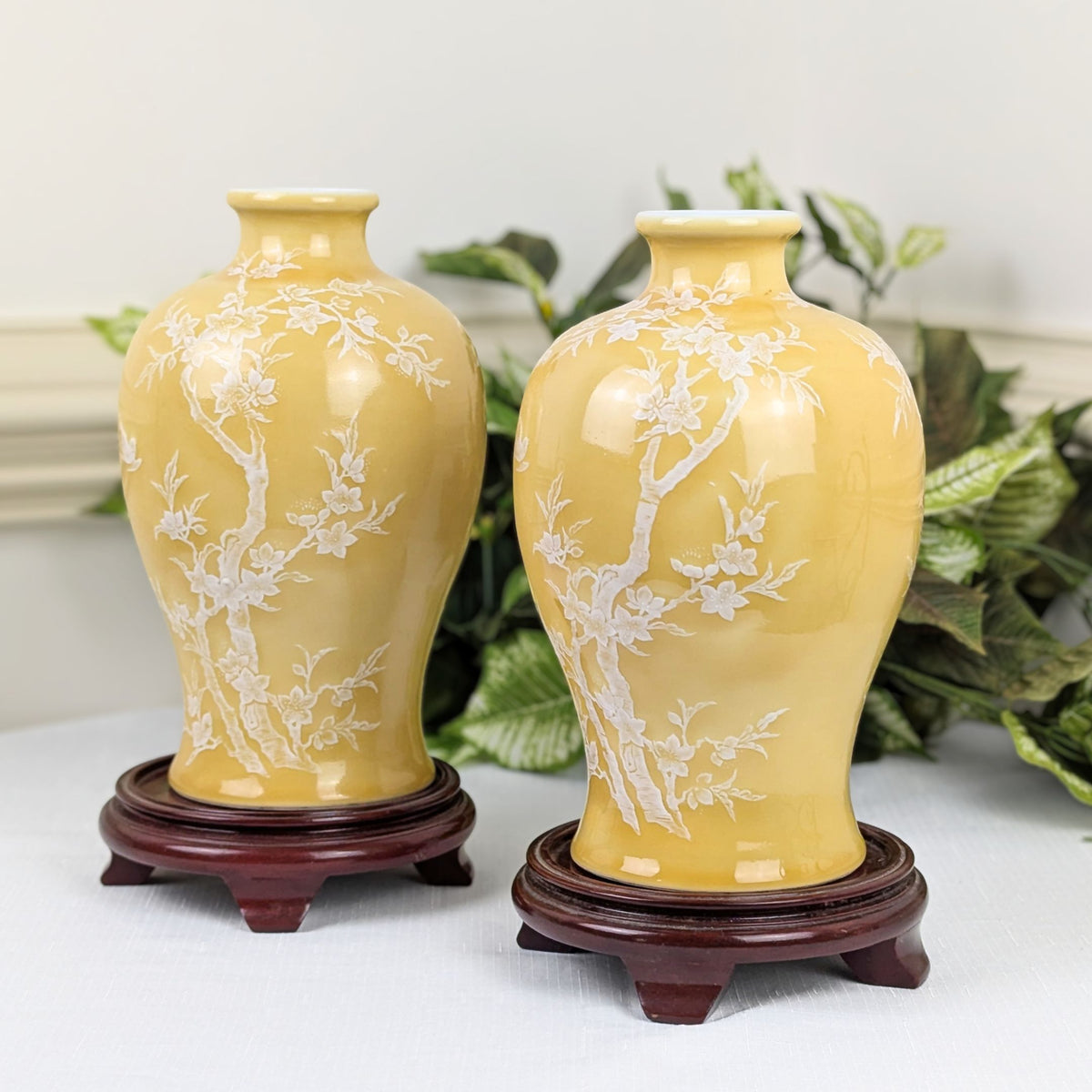 Pair of Pâte-sur-Pâte Porcelain Vases with Decorative Wood Stands