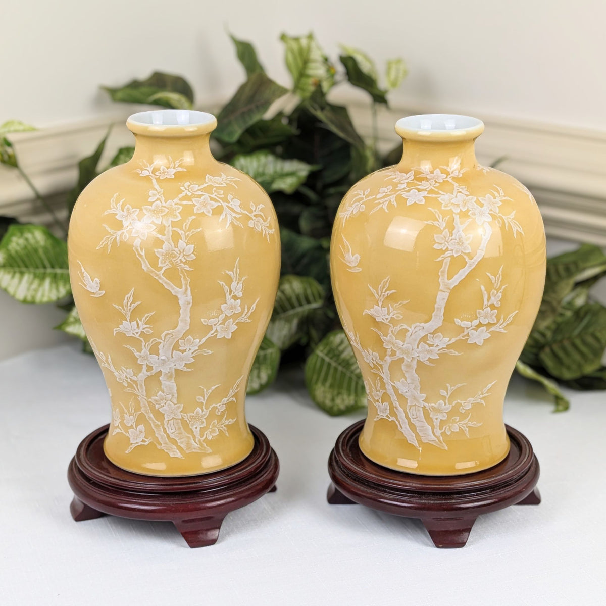 Pair of Pâte-sur-Pâte Porcelain Vases with Decorative Wood Stands