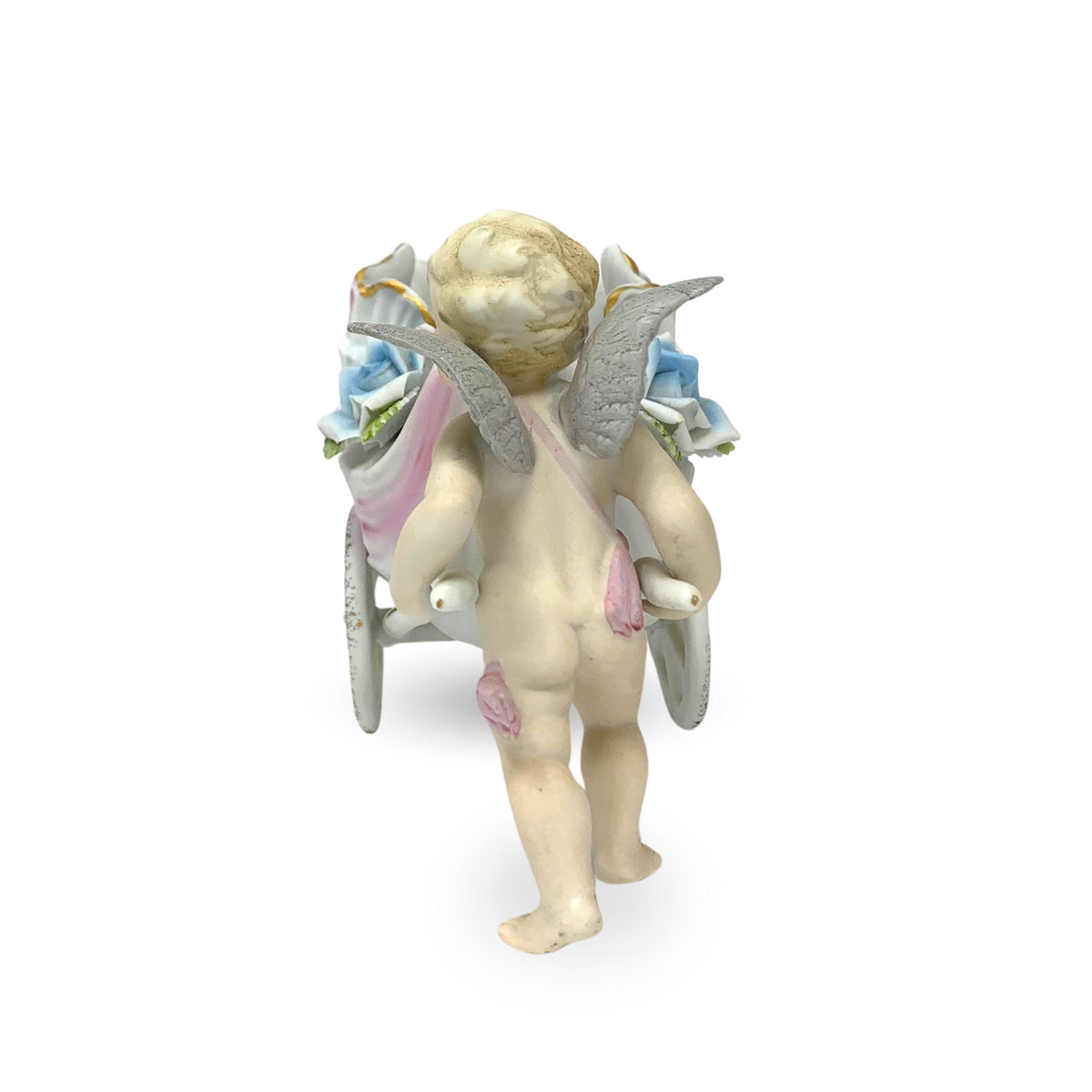 Porcelain Cherub Pushing a Seashell Wheelbarrow