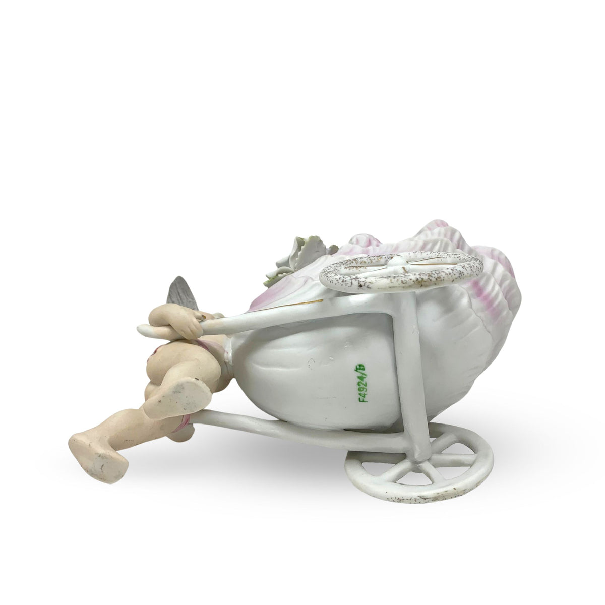 Porcelain Cherub Pushing a Seashell Wheelbarrow