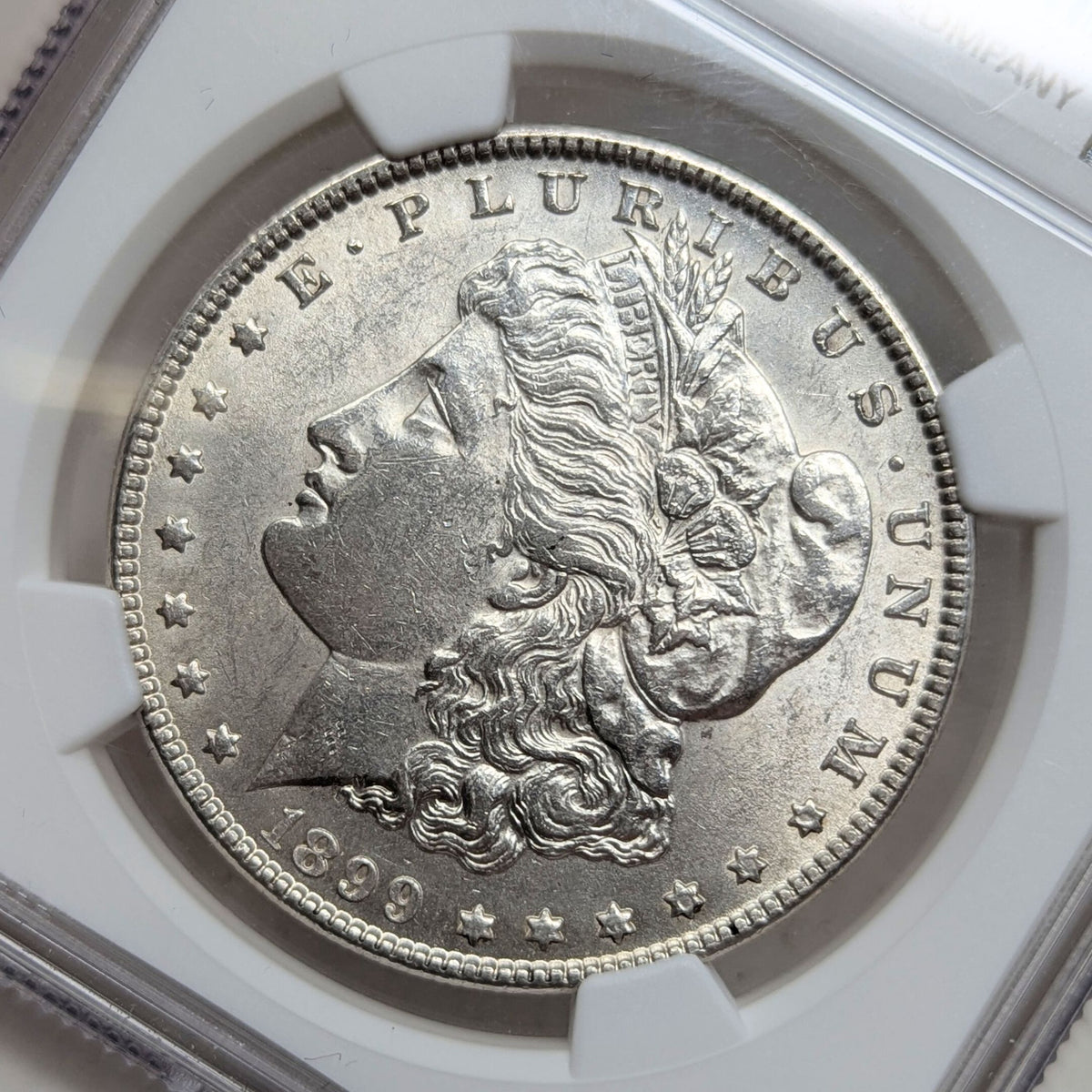 1899 NGC AU58 Morgan Silver Dollar